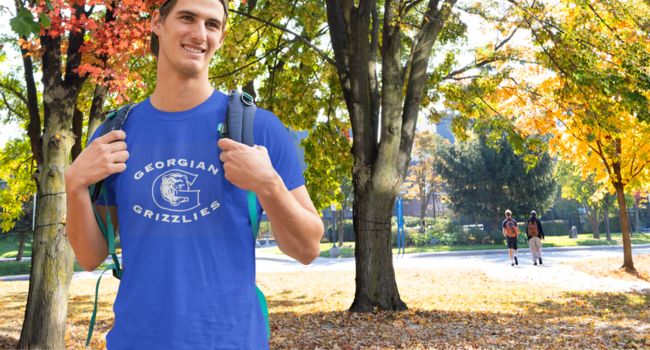 Student wearing a royal blue Georgian Grizzlies t-shirt
